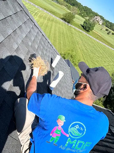 MDF service crew performing professional HVAC trunk line sanitation for a customer in Wheaton IL